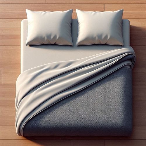 a pillow-flip style throw blanket on a bed, with the blanket's lengthwise edges half-folded towards the center