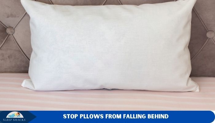 how to stop pillows from falling behind adjustable bed