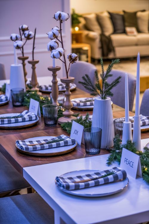 Christmas table decor ideas showing farmhouse and modern themes with wooden candleholders, buffalo check napkins, metallic accents, and icy blue, purple, and gold color palette for a cozy festive atmosphere.