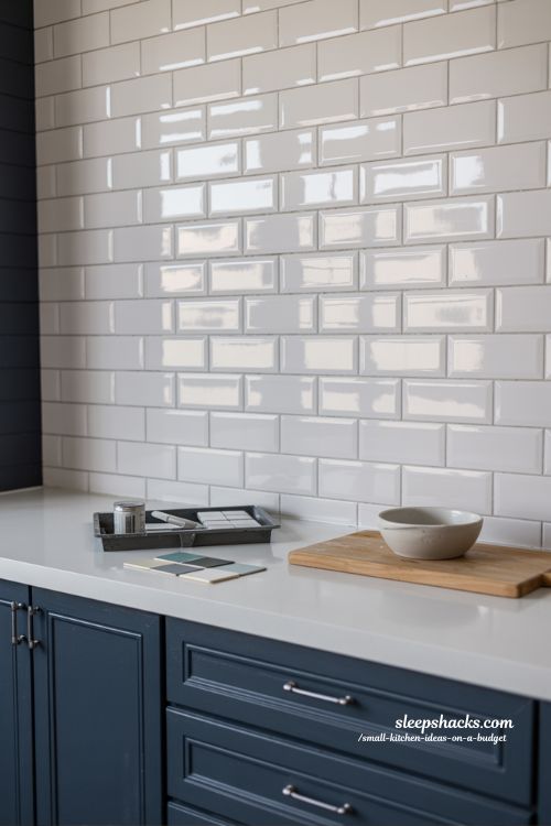 Budget DIY Kitchen Makeover: High-End Look with Peel-and-Stick Tiles and Cabinet Paint