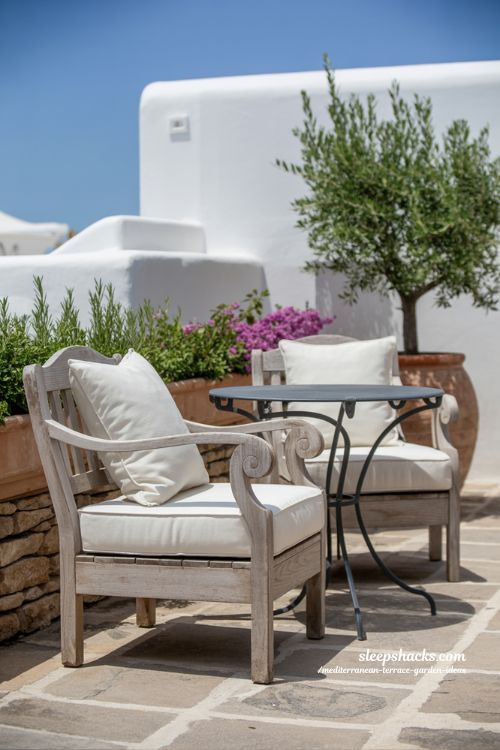 Classic Mediterranean Terrace with Durable Wrought Iron and Timeless Wood Furniture