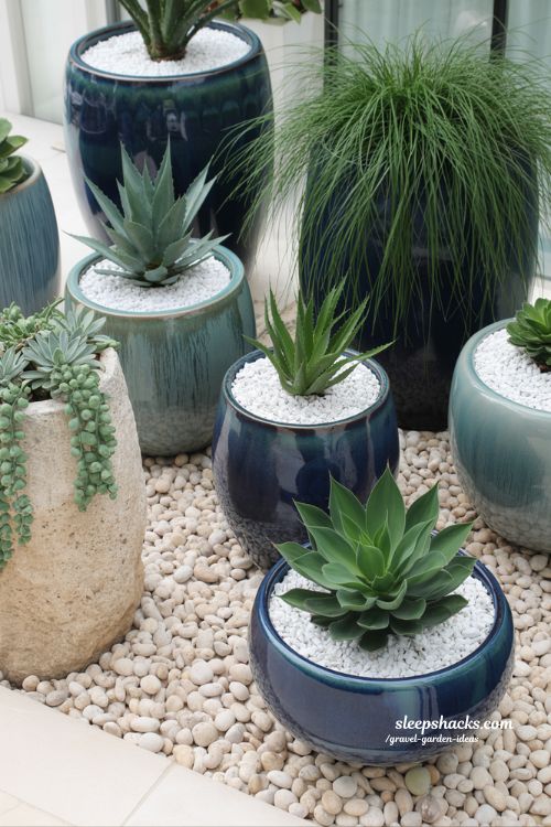 Creative Container Gravel Garden with Tiered Ceramic Pots and Decorative Stone