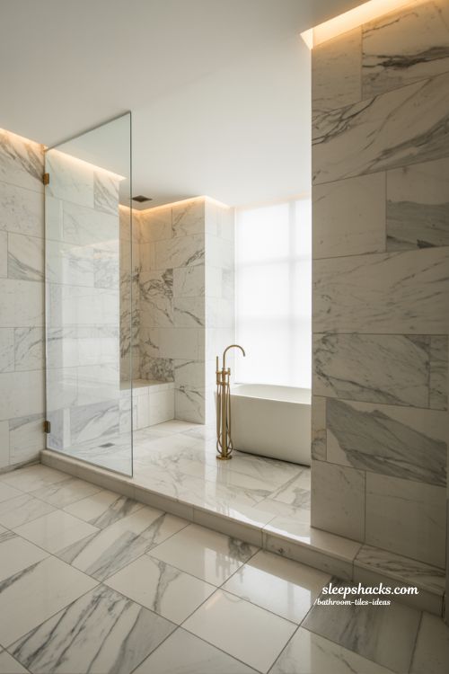 Grand Marble Master Bathroom with Large Format Calacatta Tiles and Warm Ambient Glow
