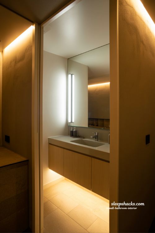 Layered lighting small bathroom interior ideas with mirror task lights ambient glow and modern Japandi minimalist design