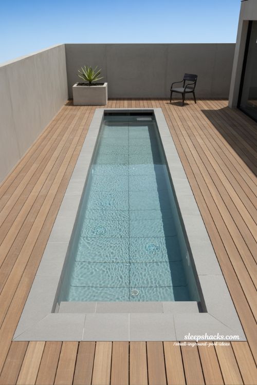 Linear Modern Inground Lap Pool with Minimalist Composite Decking and Concrete Accents