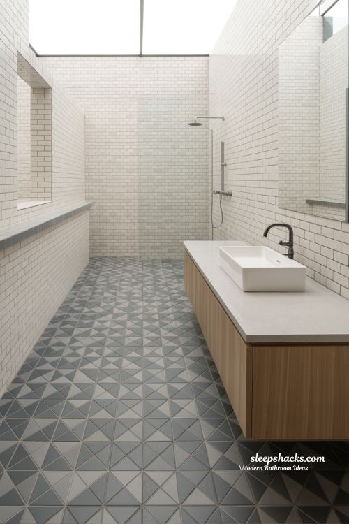 Modern Bathroom with Geometric Patterned Floor Tiles and Minimalist White Walls
