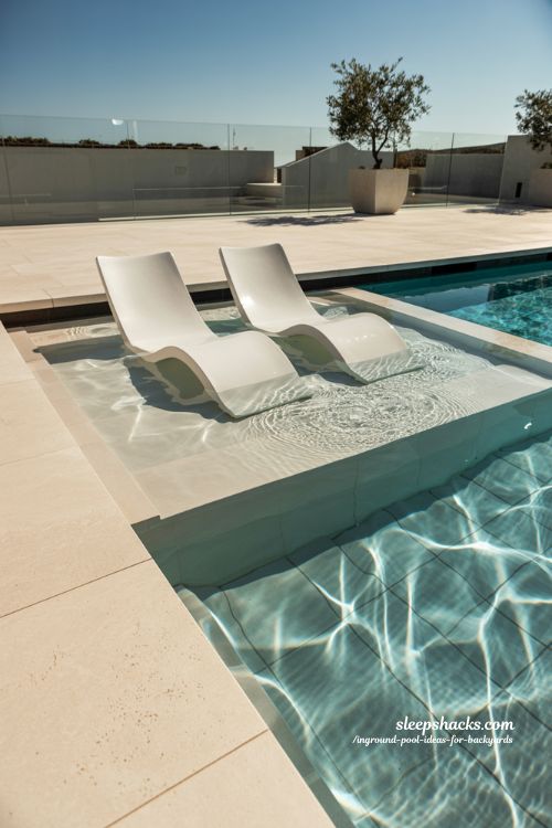 Modern Inground Pool with Luxury Sun Shelf and Submerged Ledge Loungers