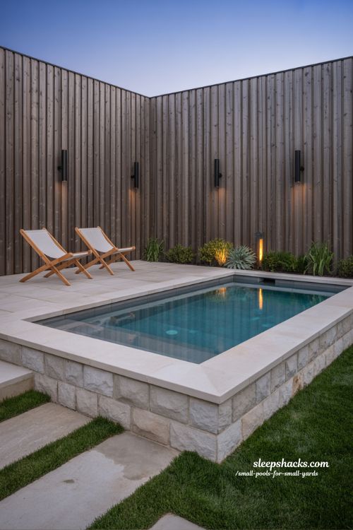 Modern Minimalist Plunge Pool for Small Backyards with Stone Coping and Warm Ambient Lighting