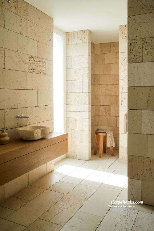 Organic Spa Bathroom with Honed Travertine Stone Tiles and Natural Wood Accents