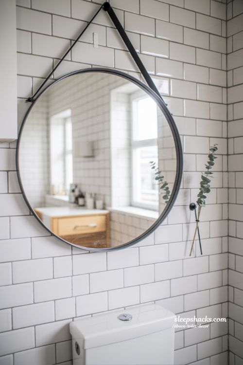 Round Pivot Mirror Above Toilet to Brighten Small Bathroom