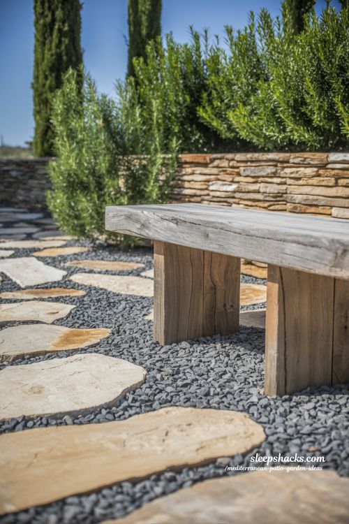 Rustic Mediterranean Stone Patio with Weathered Wood Accents and Gravel Pathways