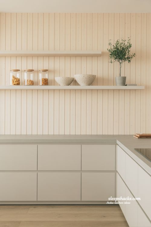 Scandi-Boho Kitchen with Light Pine Wood Wall and Minimalist White Cabinets
