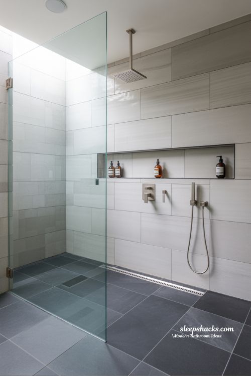 Seamless Walk-In Shower with Frameless Glass and Minimalist Built-In Wall Niches
