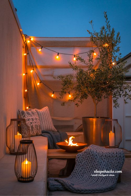 Small backyard lighting ideas featuring warm string lights and lanterns to create a cozy and expansive outdoor space at night