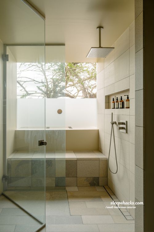 Smart small bathroom walk-in shower design with frameless glass and seamless floor tiles minimalist modern interior