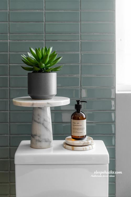 Use Height with a Pedestal: The Pro Secret to Toilet Tank Styling