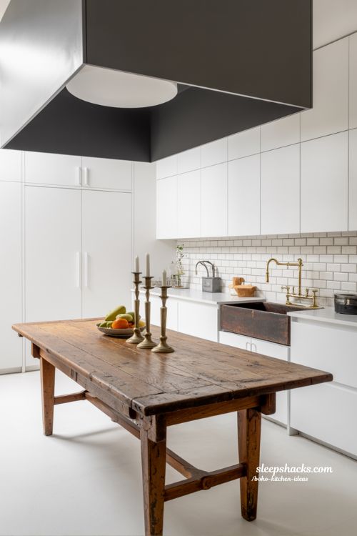 Vintage Boho Kitchen with Antique Wood Island and Modern White Cabinets