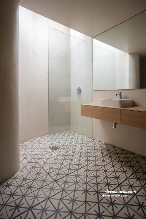 Vintage Inspired Black and White Geometric Floor Tiles with Minimalist Walk In Shower