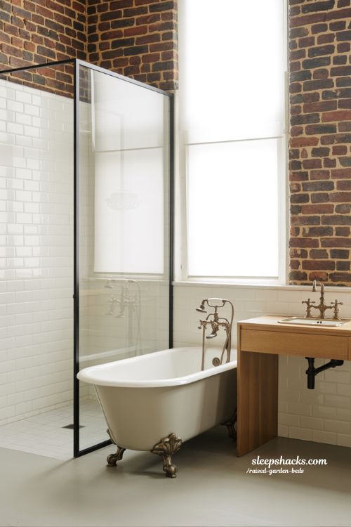 Vintage bathroom decor showing a balance of modern shower and antique clawfoot tub in sharp focus