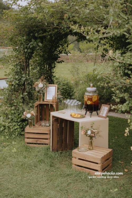 charming outdoor wedding drink station ideas with wooden crates flowers and rustic garden bar setup 