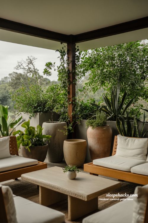 covered outdoor patio with lush green plants natural organic decor and soft modern earthy atmosphere