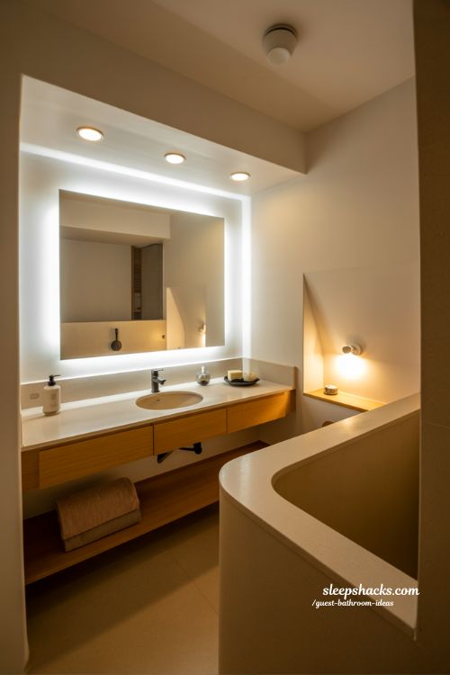 guest bathroom lighting ideas for bright inviting glow with layered modern mirror and ambient design lighting