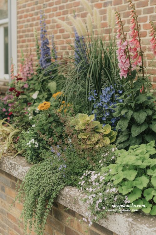 layered garden border ideas with tall medium and low plants for natural depth and texture