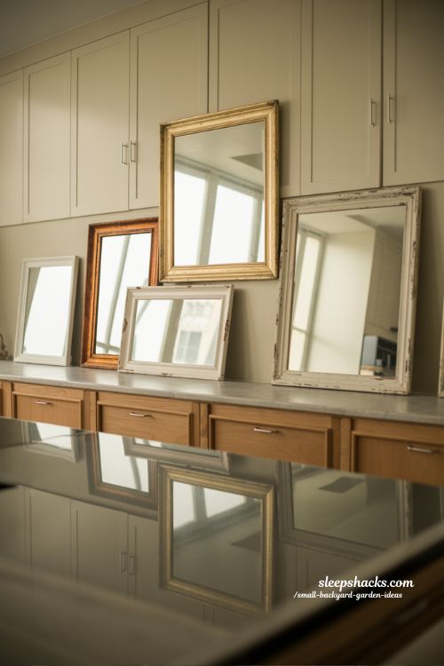 mirrors above cabinet decor ideas for small kitchens with light reflecting framed designs that create airy open modern space