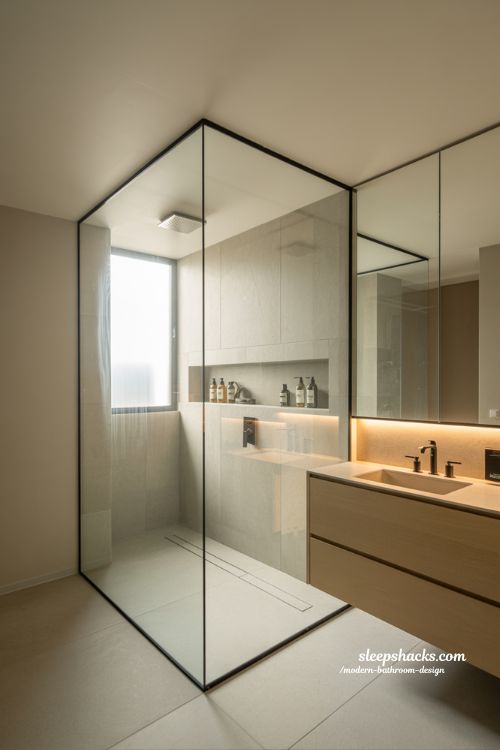 walk in shower modern bathroom design with frameless glass and minimalist stone tiles in open airy space