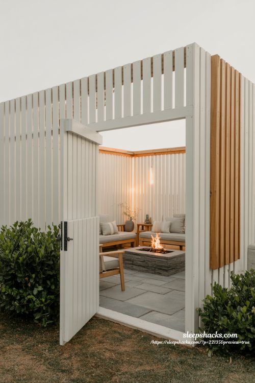 Backyard privacy ideas with DIY wood slat screen for fire pit seating area design