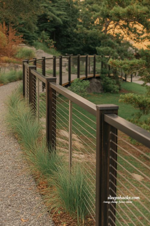 Cable fence ideas for modern backyard design with stainless steel wire and open landscape view style