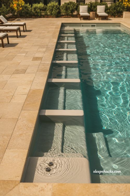 Fiberglass pool with built-in swim-up seating and modern backyard social design with in-water bench and minimalist resort style aesthetics