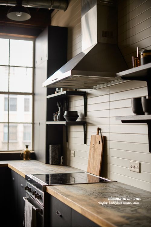 Industrial kitchen ideas with warm shiplap backsplash wood texture and modern loft style contrast design