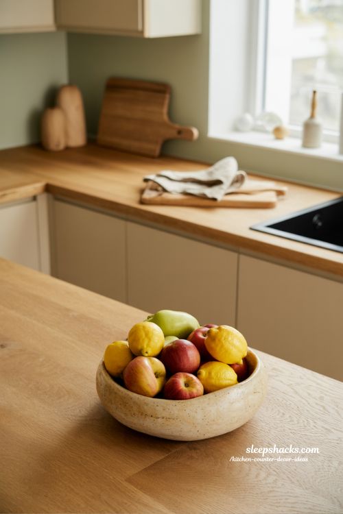 Kitchen counter decor ideas with seasonal fruit bowl for fresh natural kitchen styling 