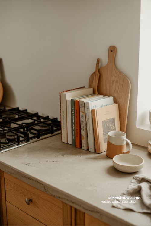 Kitchen counter decor ideas with styled cookbooks for a lived-in kitchen feel 