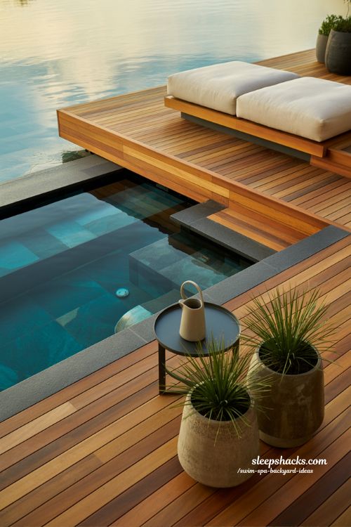 Modern multi level deck with built in swim spa and luxury wood finishes for a contemporary backyard