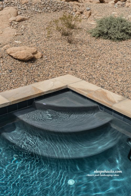 Pebble tec desert pool with decomposed granite gravel landscape and natural stone backyard design