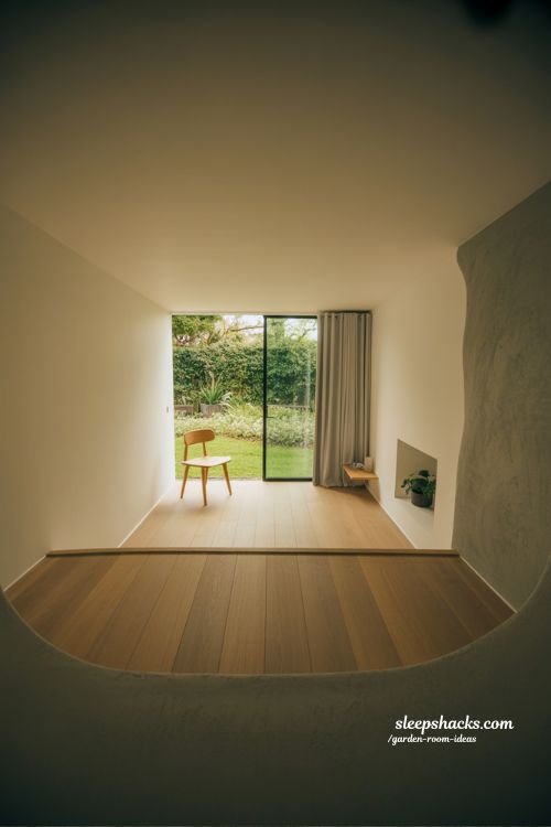 Personal garden escape pod minimalist quiet retreat space with simple chair and calming empty design silence focused interior