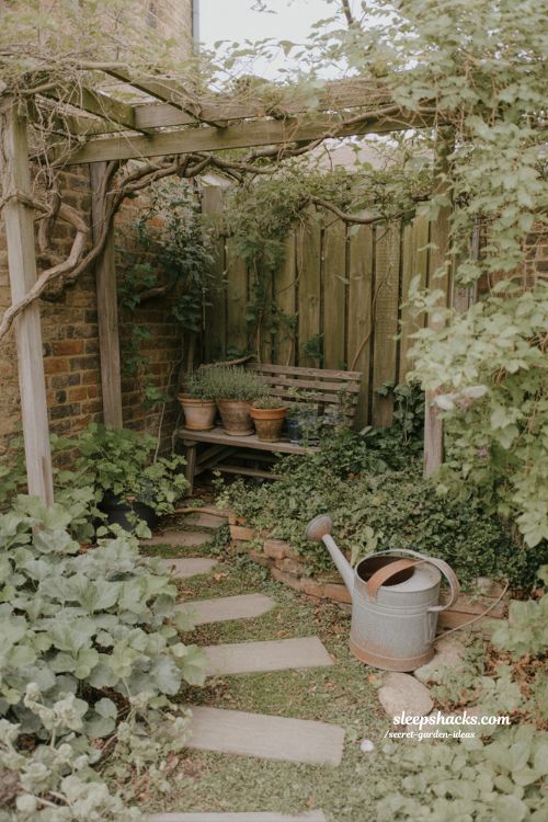 Secret garden ideas cozy hidden backyard nook with layered plants and winding stone path 