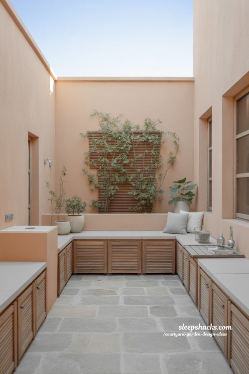Small courtyard garden with hidden storage for clean minimalist outdoor space