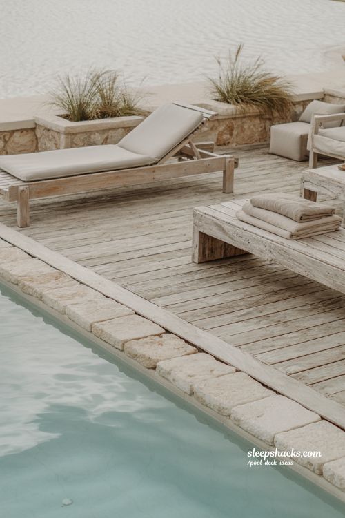Weathered wood pool deck with silver gray patina and modern coastal backyard style 