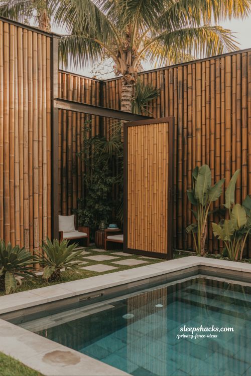 bamboo privacy fence ideas for a zen poolside backyard with tropical resort style and natural screening