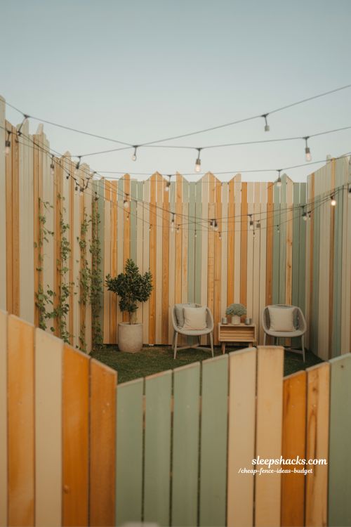 budget backyard transformation with simple wood fence and cozy lighting ideas 