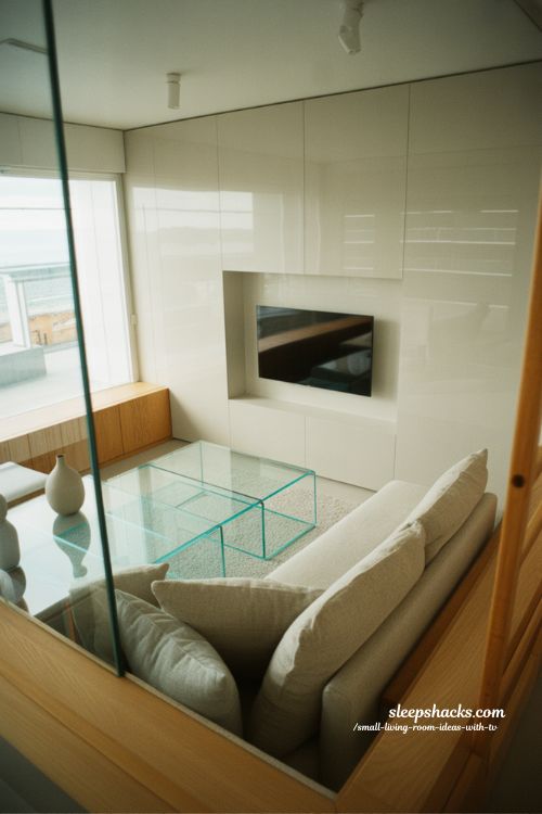 glass furniture for light visual flow in a small modern living room with airy minimalist design