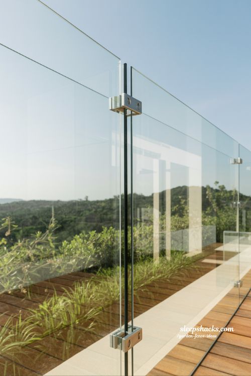 glass panel garden fence with frameless design and unobstructed scenic backyard view