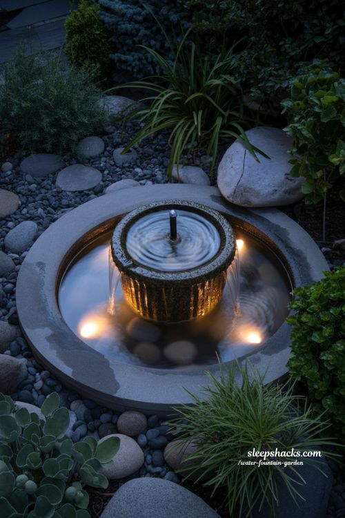 led lighting water fountain garden at night with soft glowing calm and cinematic mood