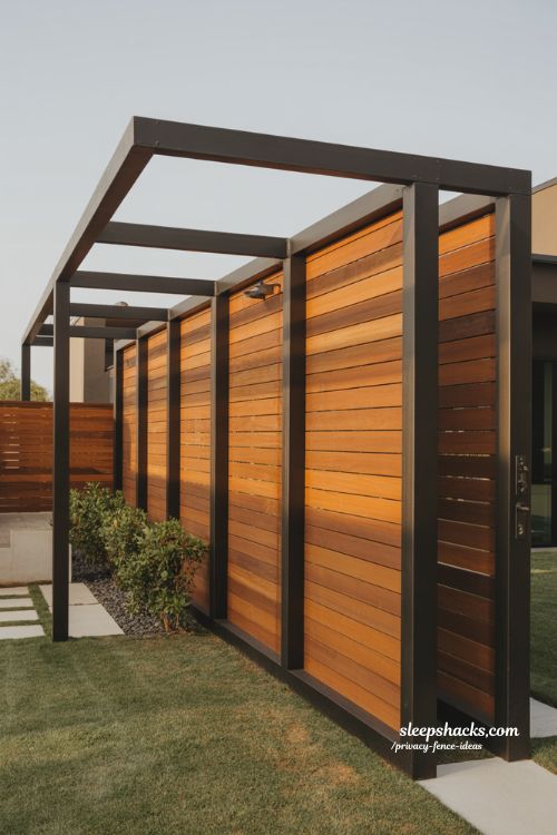 modern black metal frame fence with wood infill panels for a durable and stylish privacy backyard design