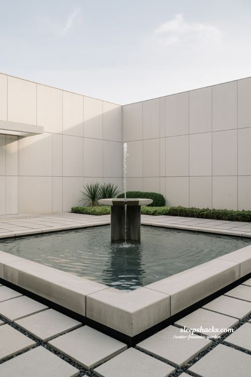 modern minimal water fountain garden with clean concrete design and calm structured elegance
