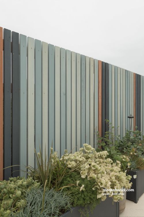 painted timber slat garden fence in muted sage and terracotta tones with modern cottage landscaping