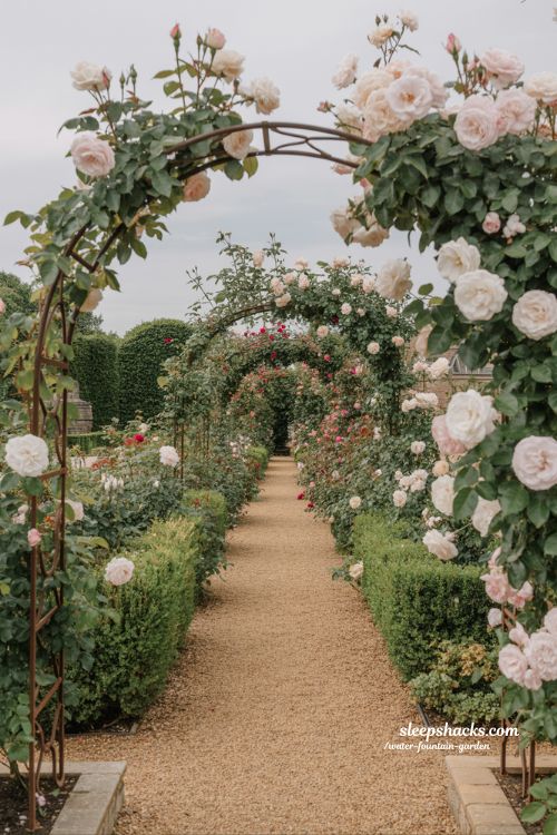 romantic rose garden walkway ideas with arch tunnels stone paths and immersive floral path design